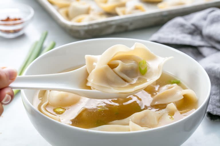 <p>This is so much easier than waiting around for a takeaway.</p><p>Get the <a href="https://www.delish.com/uk/cooking/recipes/a29185394/easy-wonton-soup-recipe/" rel="nofollow noopener" target="_blank" data-ylk="slk:Wonton Soup;elm:context_link;itc:0;sec:content-canvas" class="link ">Wonton Soup</a> recipe.</p>