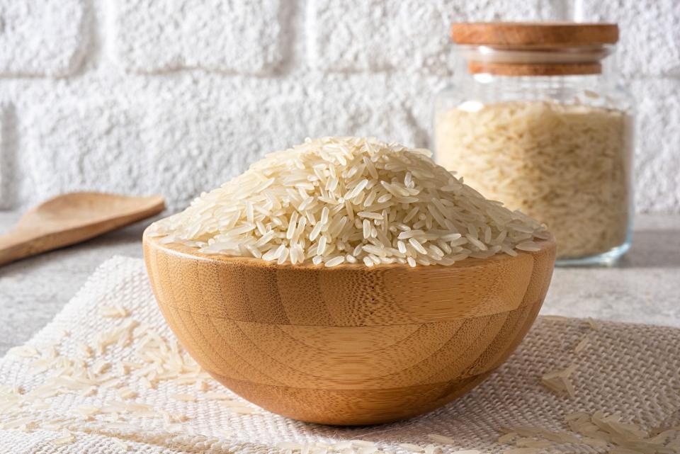 Uncooked Jasmin Rice in Wood Bowl