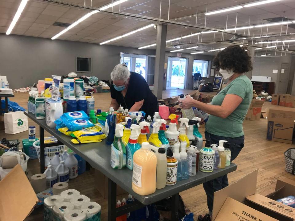 Volunteers Lori Croker and Rebecca Cerese sort through items at a donation center in Fuquay-Varina for Afghan refugees coming to the Triangle, on Saturday, Sept. 4, 2021.