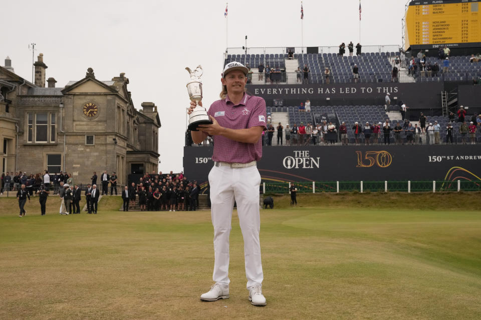 Cameron Smith, of Australia, holds the claret jug trophy after winning the British Open golf championship on the Old Course at St. Andrews, Scotland, Sunday July 17, 2022. (AP Photo/Gerald Herbert)