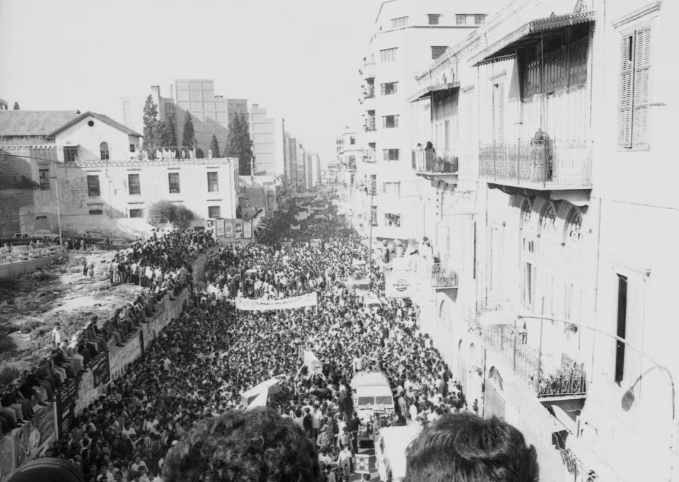FILE - A sea of mourners followed the funeral procession for the slain Palestinian leaders killed in Israeli rad in Beirut on April 12, 1973. Israeli commando force led by a man disguised as brunette, Ehud Barak, who later rose to become Israel's prime minister infiltrated a posh Beirut neighborhood shooting dead three top officials with the Palestine Liberation Organization in two separate adjacent buildings. (AP Photo, File)