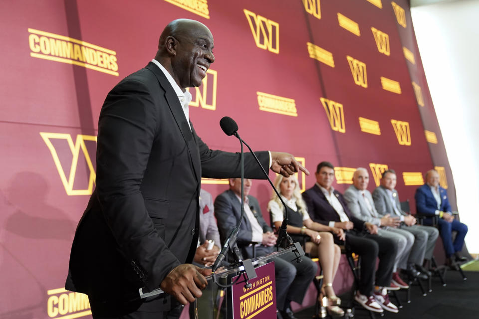 Magic Johnson, a member of the group buying the Washington Commanders, speaks at an introductory NFL football news conference at FedEx Field in Landover, Md., Friday, July 21, 2023. (AP Photo/Alex Brandon)