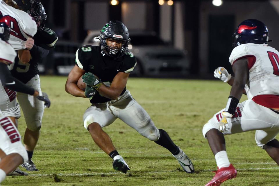 Choctawhatchee High School's Cole Tabb runs the ball during the Indian's game against Fort Walton Beach High School at Etheredge Stadium on Friday, Oct. 28, 2022.