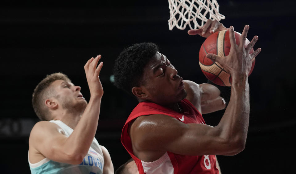 Japan's Rui Hachimura (8), right, grabs a rebound in front of Slovenia's Edo Muric (8) during men's basketball preliminary round game at the 2020 Summer Olympics, Thursday, July 29, 2021, in Saitama, Japan. (AP Photo/Eric Gay)