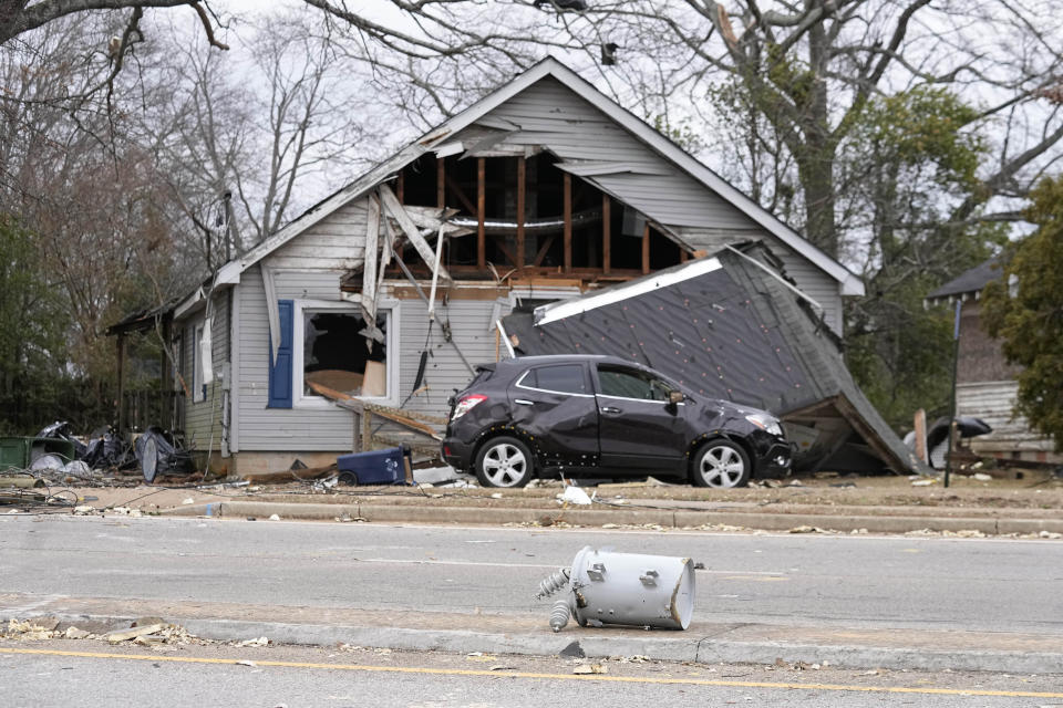 A power transformer sits in a street infant of a storm-damaged building Friday, Jan. 13, 2023, in Griffin, Ga. Powerful storms passed through Thursday causing tornadoes. (AP Photo/John Bazemore)