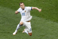 <p>Artyom Dzyuba jumps to celebrate after scoring Russia’s equalising goal </p>