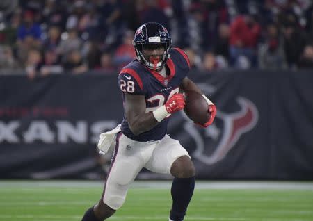 FILE PHOTO: Nov 26, 2018; Houston, TX, USA; Houston Texans running back Alfred Blue (28) carries the ball in the fourth quarter against the Tennessee Titans at NRG Stadium. Mandatory Credit: Kirby Lee-USA TODAY Sports - 11739549