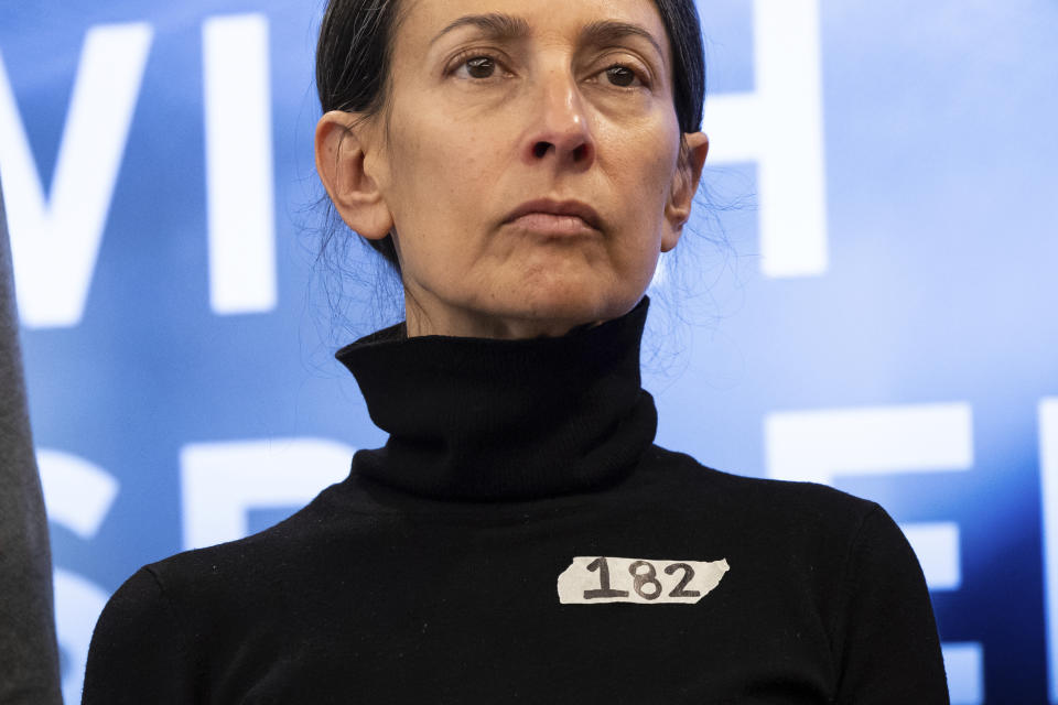 Rachel Goldberg, a mother of American hostage Hersh Goldberg-Polin, is seen wearing a sticker writing a number 182, during a press conference by families of American hostages in Gaza and elected officials, Friday, April. 5, 2024, in New York. (AP Photo/Yuki Iwamura)