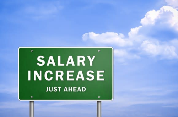 A sign says salary increase just ahead