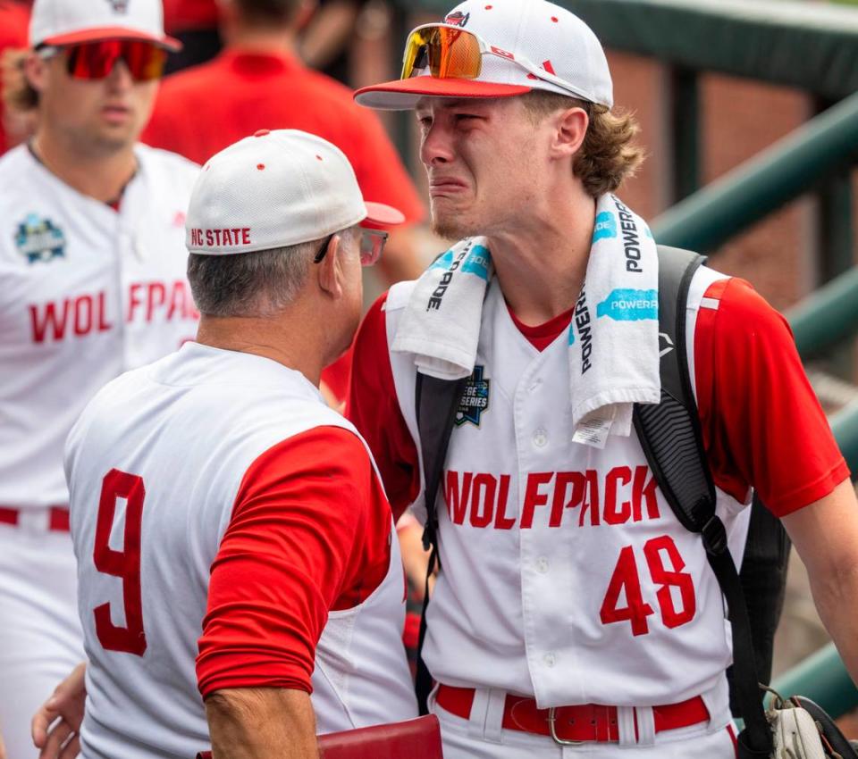 N.C. State pitcher Andrew Shaffner (48) becomes emotional after embracing coach Elliott Avent following the Wolfpack’s 5-4 season ending loss to Florida in game seven of the College World Series on Monday, June 17, 2024 at Charles Schwab Field in Omaha, Nebraska.