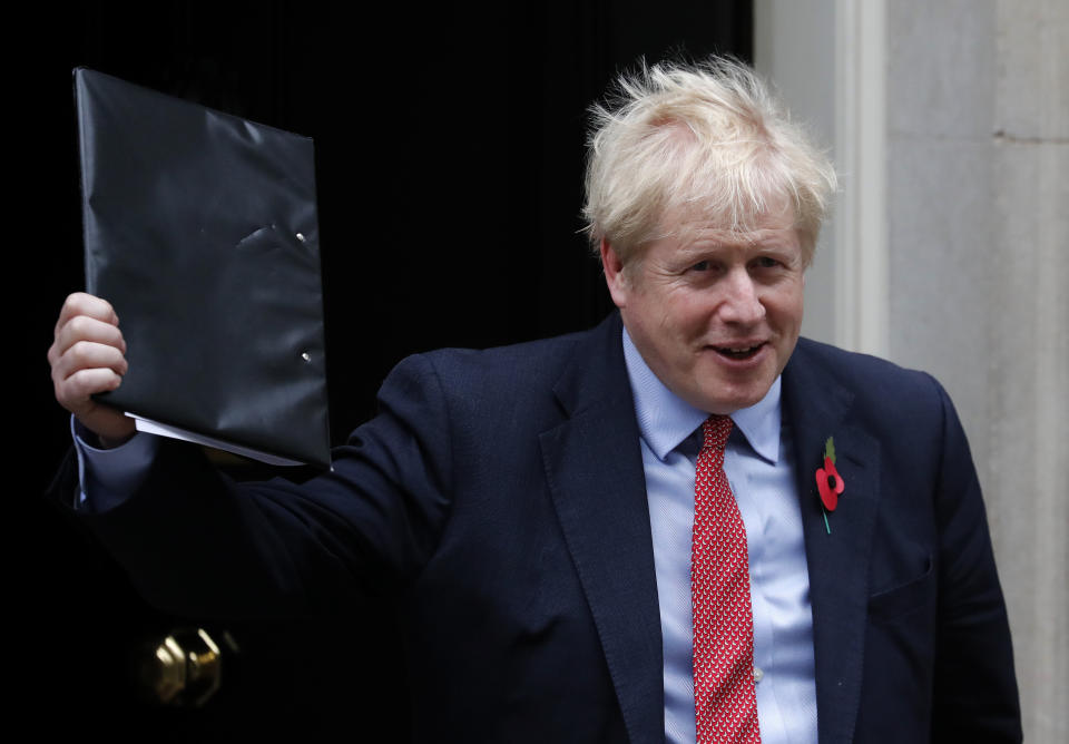 Britain's Prime Minister Boris Johnson leaves 10 Downing Street on his way to the Houses of Parliament in London, Tuesday, Oct. 29, 2019. Britain appeared on course Tuesday for an early general election that could break the country's political deadlock over Brexit, after the main opposition Labour Party said it would agree to the government's request to send voters to the polls in December. (AP Photo/Frank Augstein)