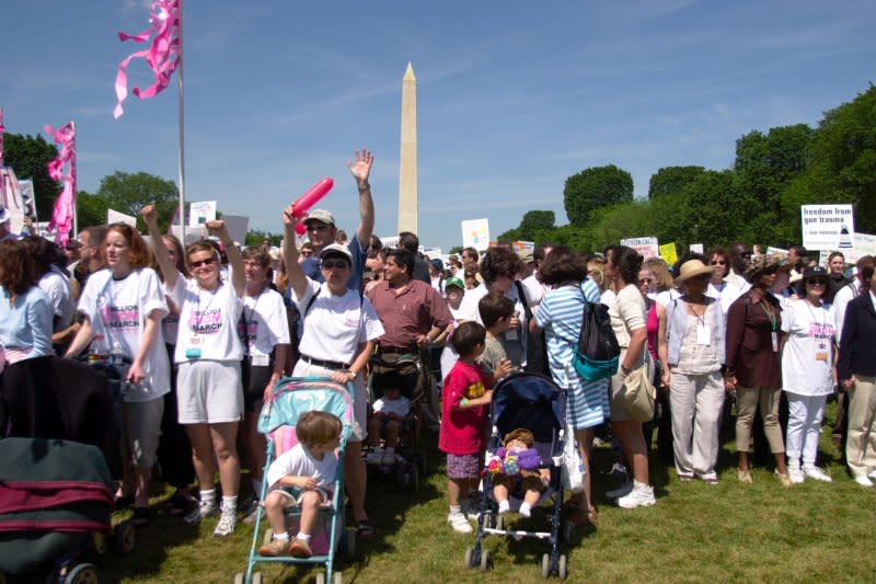 Marchers in the Million Mom March start out walking down the National Mall with the Washington Monument in the background on May 14, 2000. File Photo by Joel Rennich/UPI