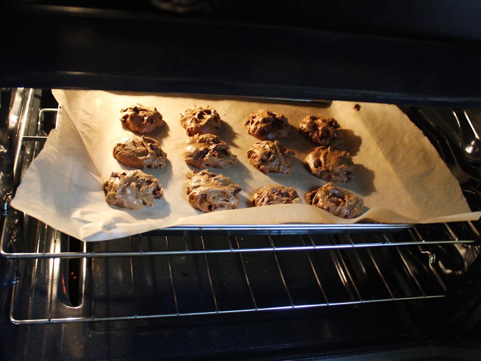 chocolate chip cookies on a baking sheet in the oven