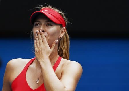 Maria Sharapova of Russia celebrates after defeating Eugenie Bouchard of Canada in their women's singles quarter-final match at the Australian Open 2015 tennis tournament in Melbourne January 27, 2015. REUTERS/Thomas Peter