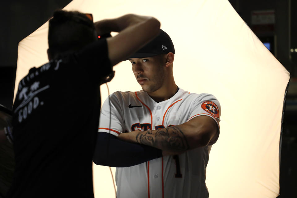Houston Astros' Carlos Correa poses during photo day before a spring training baseball practice Tuesday, Feb. 18, 2020, in West Palm Beach, Fla. (AP Photo/Jeff Roberson)