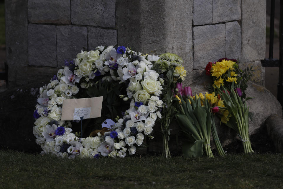 A wreath laid by Andre and Stan Walker for Prince Philip outside Windsor Castle in Windsor, England, Friday, April 16, 2021. Prince Philip husband of Britain's Queen Elizabeth II died April 9, aged 99, his funeral will take place Saturday at Windsor Castle in St George's Chapel. (AP Photo/Alastair Grant)