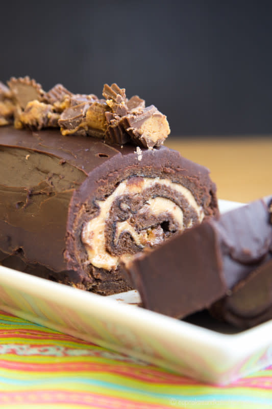 <p>Cupcakes and Kale Chips</p><p>This Peanut Butter Cup Flourless Chocolate Cake Roll recipe is way too easy to be this impressive and amazing.</p><p><strong>Get the recipe: </strong><strong><a href="https://cupcakesandkalechips.com/peanut-butter-cup-flourless-chocolate-cake-roll/" rel="nofollow noopener" target="_blank" data-ylk="slk:Peanut Butter Cup Flourless Chocolate Cake Roll;elm:context_link;itc:0;sec:content-canvas" class="link ">Peanut Butter Cup Flourless Chocolate Cake Roll</a></strong></p>