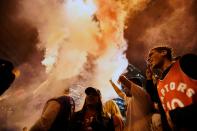 Toronto Raptors fans celebrate their win in the NBA championships in downtown Toronto, Ontario on early June 14, 2019. (Photo by Geoff Robins / AFP) (Photo credit should read GEOFF ROBINS/AFP/Getty Images)