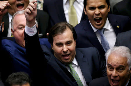 Congressman Rodrigo Maia, of the center-right Democrats party (C), celebrates after being re-elected to the lower house of Brazil's Congress in Brasilia, Brazil, February 2, 2017. REUTERS/Adriano Machado