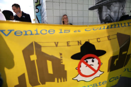 People protest outside a Snap Inc. office in Venice, a beach community of Los Angeles, California, U.S., March 2, 2017. REUTERS/Lucy Nicholson