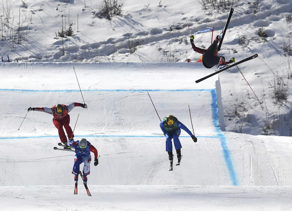 <p>Christopher Del Bosco of Canada, right, flies through the air as Sergey Ridzik, Olympic Athletes of Russia, left to right, Francois Place of France and Siegmar Klotz of Italy compete in the men’s ski cross elimination round at the 2018 Winter Olympic Games in Pyeongchang, South Korea, Wednesday, Feb. 21, 2018. THE CANADIAN PRESS/Jonathan Hayward </p>