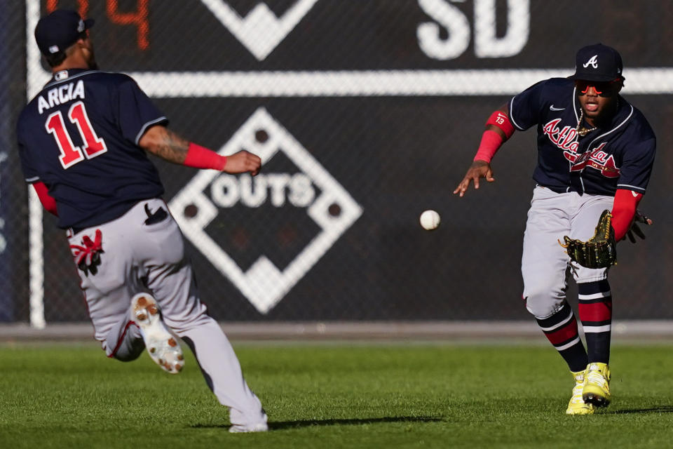 Atlanta Braves right fielder Ronald Acuna Jr. (13) works for a catch on an RBI-single hit by Philadelphia Phillies Rhys Hoskins during the sixth inning in Game 4 of baseball's National League Division Series, Saturday, Oct. 15, 2022, in Philadelphia. (AP Photo/Matt Slocum)