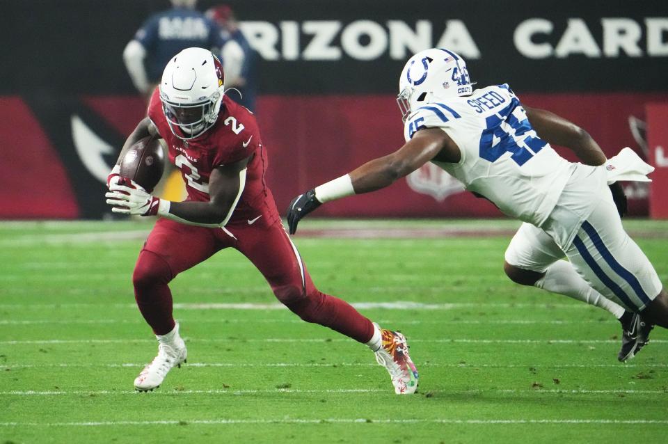 Dec 25, 2021; Glendale, Arizona, USA; Arizona Cardinals running back Chase Edmonds (2) runs with the ball against Indianapolis Colts linebacker E.J. Speed (45) in the first half at State Farm Stadium. Mandatory Credit: Rob Schumacher-Arizona Republic