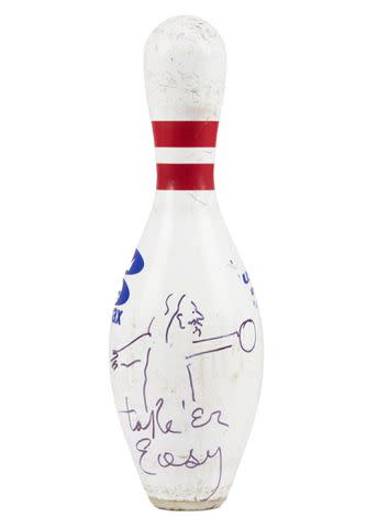 <p>Julien's Auctions</p> A signed replica bowling pin from the actor is also being auctioned