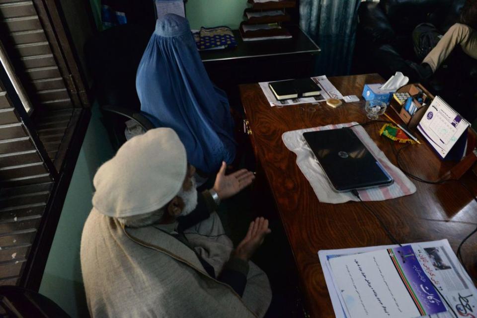 Nadia, 22, an Afghan woman who is trying to get divorced from her husband, sits with her father during an interview with an AFP journalist at her lawyer's office in Jalalabad on Jan. 16, 2017. When Nadia's heroin addict husband began assaulting her with a metal rod, she did something unthinkable for many women in Afghanistan -- she left him. Domestic abuse is endemic in Afghanistan, but a growing number of Afghan women are embracing divorce as a new kind of empowerment.
