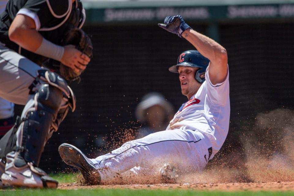 Guardians center fielder Myles Straw slides safely into home to score a run on an RBI-double by Amed Rosario in the fifth inning in the first game of a doubleheader against the Chicago White Sox on Tuesday. The Guardians won 4-1. [David Dermer/Associated Press]