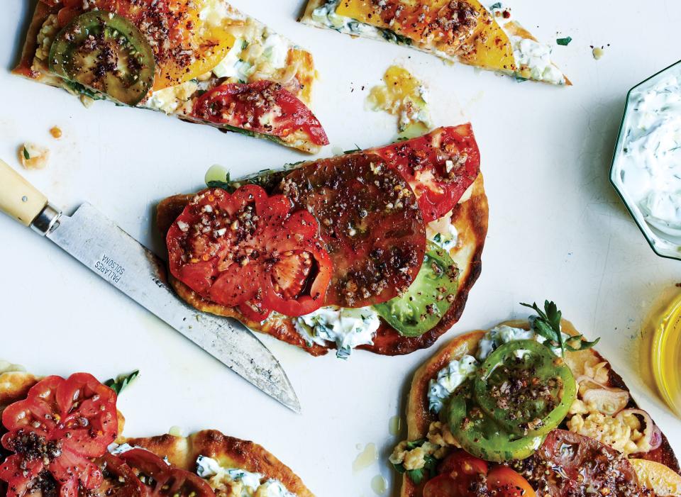 To make this tomato-on-bread revelation right this very minute, use a prepared flatbread like naan or pocketless pita. <a rel="nofollow noopener" href="https://www.bonappetit.com/recipe/falafel-spiced-tomatoes-and-chickpeas-on-flatbread?mbid=synd_yahoo_rss" target="_blank" data-ylk="slk:See recipe.;elm:context_link;itc:0;sec:content-canvas" class="link ">See recipe.</a>