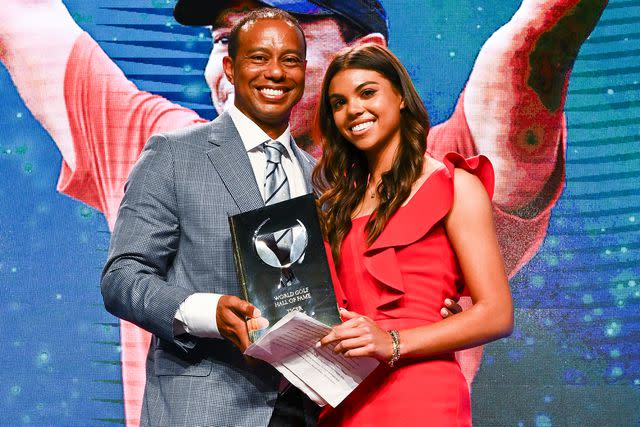 <p> Chris Condon/PGA TOUR via Getty </p> Tiger Woods and his daughter Sam, pose on stage during the World Golf Hall of Fame Induction Ceremony prior to THE PLAYERS Championship at PGA TOUR Global Home on March 9, 2022, in Ponte Vedra Beach, FL.