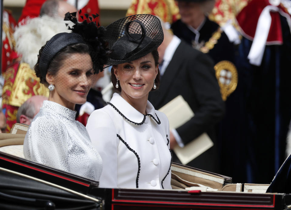 FILE - Spain's Queen Letizia and Britain's Kate, the Duchess of Cambridge leave the Order of The Garter Service at Windsor Castle in Windsor, Monday, June 17, 2019. Spain’s Queen Letizia turned 50 on Thursday, Sept. 15, 2022. Spain is taking the opportunity to assess its scarred monarchy and ponder how the arrival of a middle-class commoner may help shake one of Europe’s most storied royal dynasties into a modern and more palatable institution. (AP Photo/Frank Augstein, File)