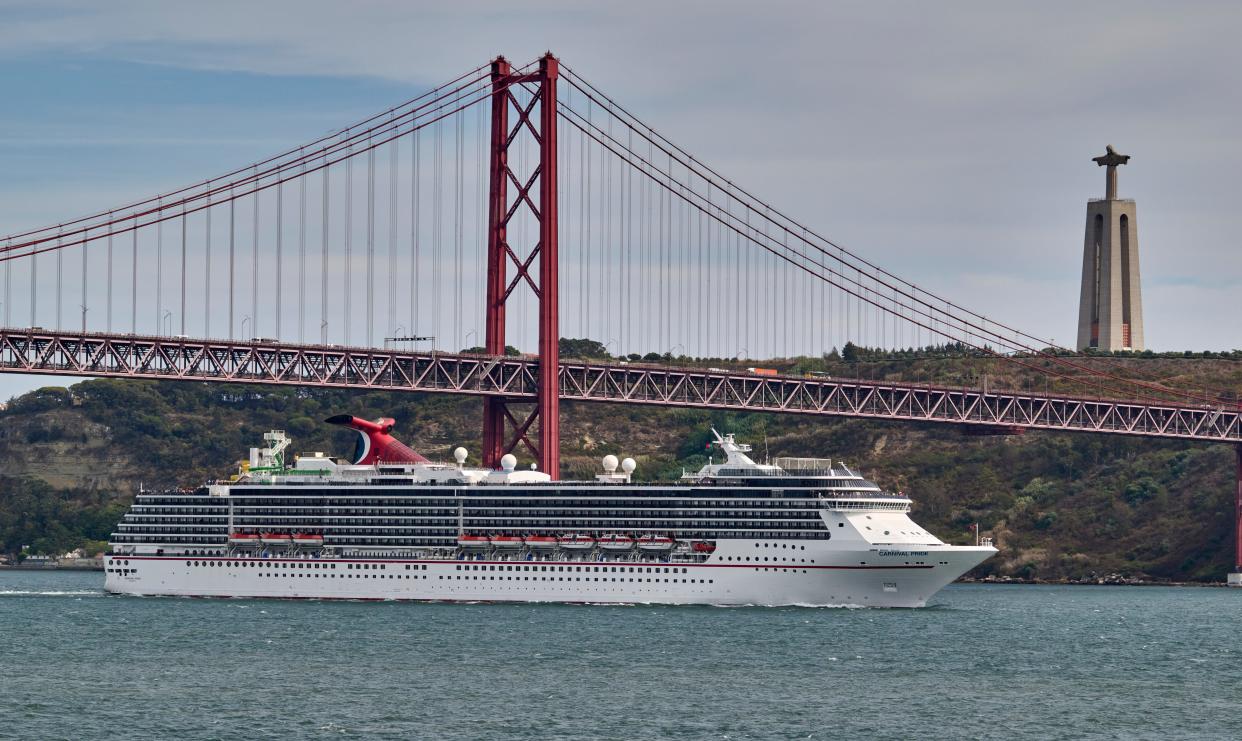 Carnival Pride, a Spirit-class cruise ship operated by Carnival Cruise Line, sails the Tagus River past 25 de Abril bridge after leaving the Cruise Terminal on September 07, 2022 in Lisbon, Portugal.