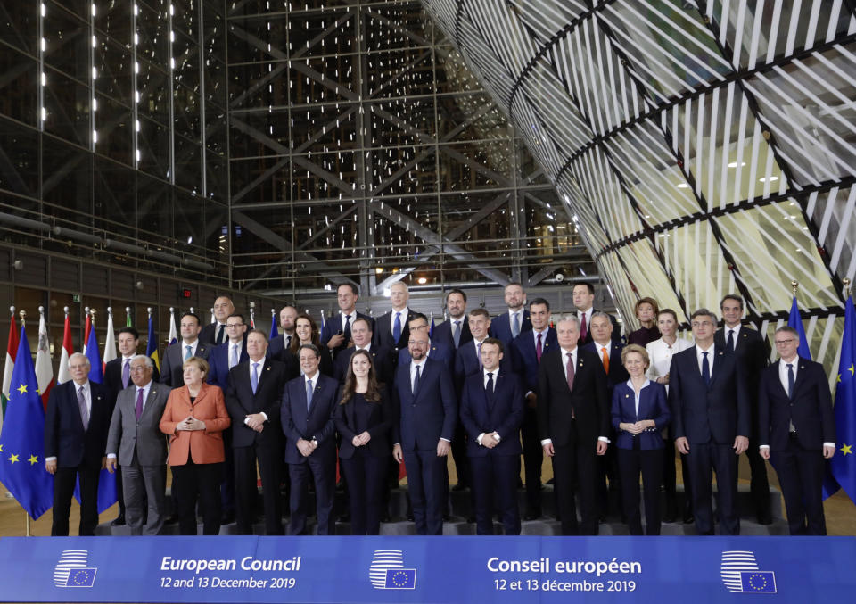 FILE - In this Thursday, Dec. 12, 2019 file photo, European Union leaders pose for a group photo during an EU summit in Brussels. European Union leaders will meet face-to-face on Friday, July 17, 2020 for their summit as they try to carve up a potential package of 1.85 trillion euros among themselves. In perhaps the first such major meeting of leaders since the COVID-19 outbreak hit the world, the stakes were just too high for attendees not to look one another in the eye. (AP Photo/Olivier Matthys, File)