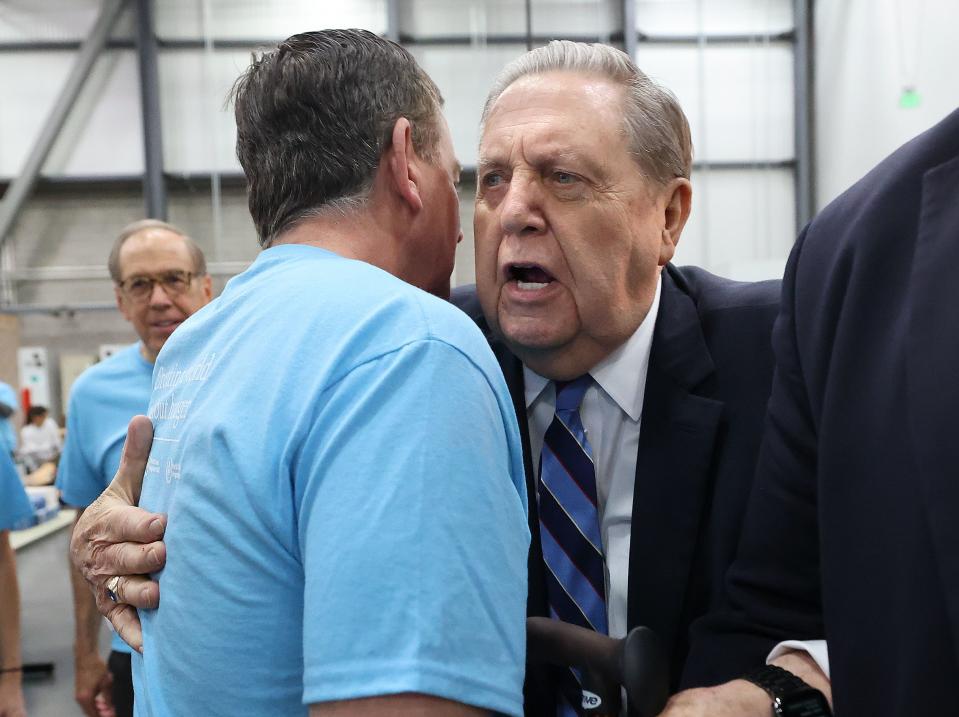 Barron Segar, World Food Program USA president and CEO, hugs Elder Jeffrey R. Holland, acting president of the Quorum of the Twelve Apostles of The Church of Jesus Christ of Latter-day Saints, during a service day hosted by the church to commemorate the 10th anniversary of its relationship with the United Nations World Food Programme and World Food Program USA, at Bishops’ Central Storehouse in Salt Lake City on Thursday, Feb. 8, 2024. | Kristin Murphy, Deseret News