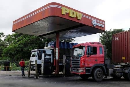 The corporate logo of the Venezuelan state-owned oil company PDVSA is seen at a gas station in Cupira, Venezuela December 16, 2018. REUTERS/Marco Bello/Files