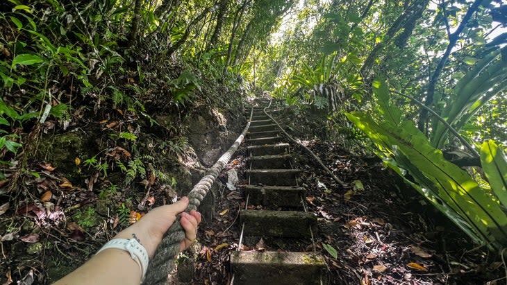 On the 2.2-mile Tuafanua Trail, a series of ropes and ladders end at a rocky beach with views of Pola Island.