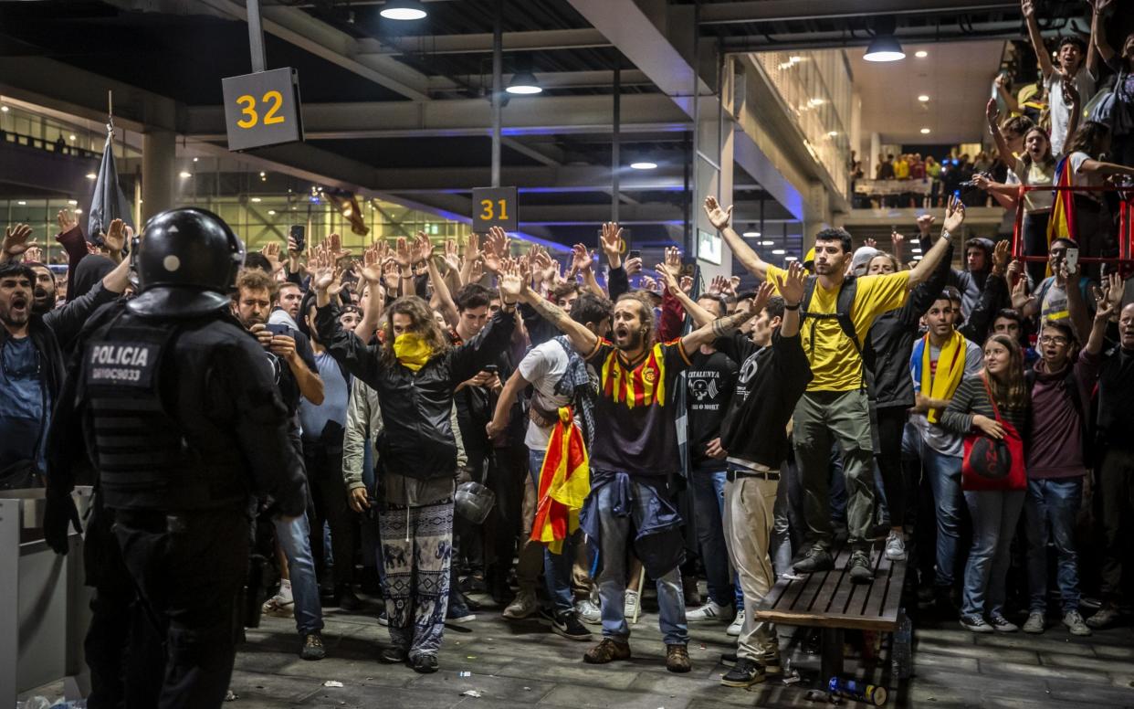 Demonstrators protest against the jailing of Catalan separatists at El Prat airport in Barcelona on Monday - Bloomberg