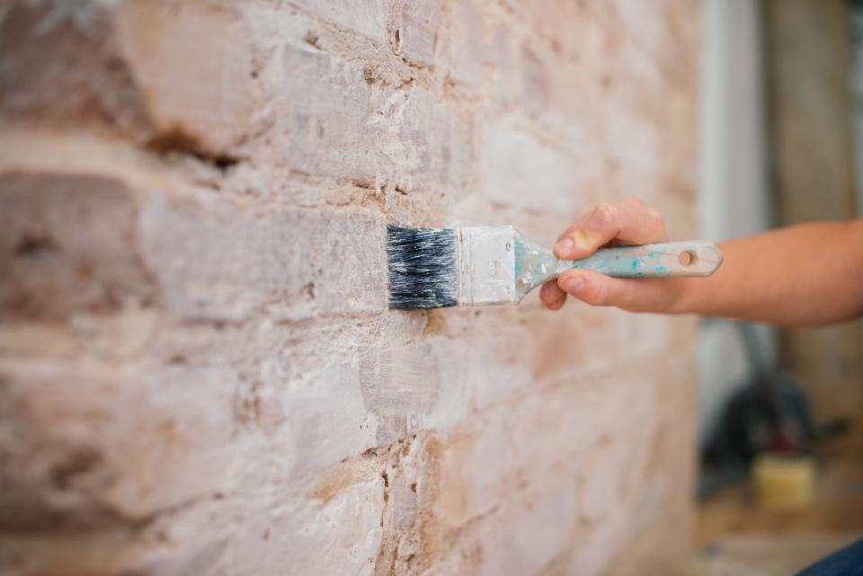 Priming the brick will make your paint job better.