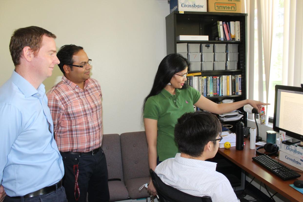 From left: David Mitchell, Satyajayant “Jay” Misra and Roopa Vishwanathan work with Casey Tran, a Ph.D. student in computer science at New Mexico State University. Misra, computer science professor, is the principal investigator and Vishwanathan and Mitchell are co-principal investigators of a research project awarded $1 million from the National Science Foundation.