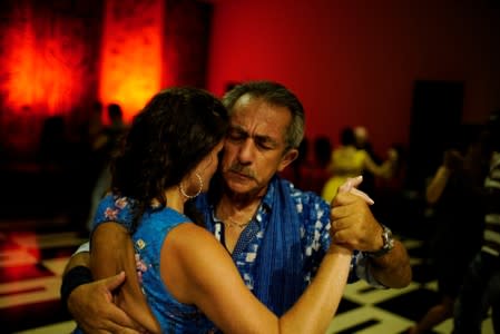 People dance tango in a hotel in Havana