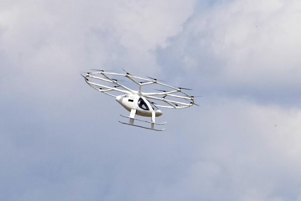 The Volocopter 2X, or VoloCity air taxi, an electric vertical takeoff and landing multicopter, performs a demonstration flight at the Paris Air Show, Wednesday, June 21, 2023 in Le Bourget, north of Paris. Aviation industry CEOs and top government officials from around the world descended on the Paris Air Show for a week of deal-making and demonstrations of the world's latest air and space technology. (AP Photo/Michel Euler)