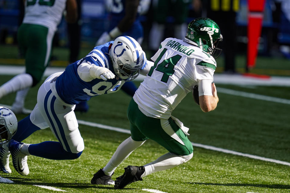 Indianapolis Colts defensive tackle DeForest Buckner (99) pressures New York Jets quarterback Sam Darnold (14) In the first half of an NFL football game in Indianapolis, Sunday, Sept. 27, 2020. (AP Photo/Darron Cummings)