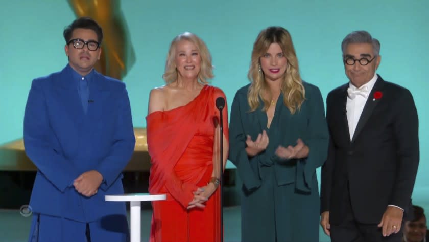 In this video grab issued Sunday, Sept. 19, 2021, by the Television Academy, Dan Levy, Catherine O'Hara, Annie Murphy and Eugene Levy present the award for outstanding writing for a comedy series during the Primetime Emmy Awards. (Television Academy via AP)