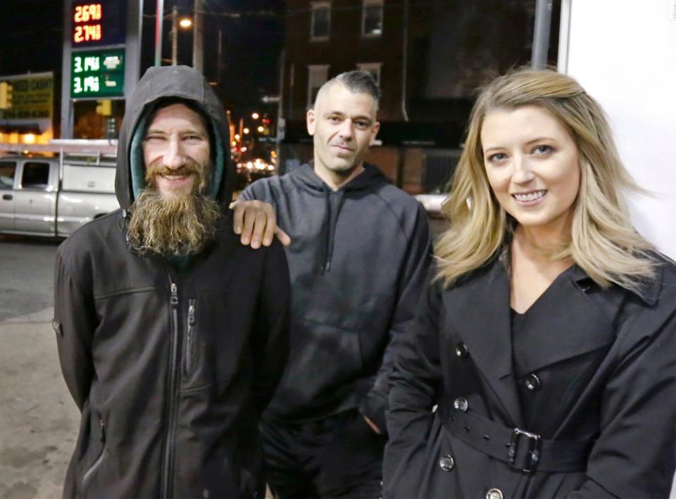 Johnny Bobbitt Jr., left, Kate McClure, right, and Mark D'Amico | Elizabeth Robertson/The Philadelphia Inquirer/AP