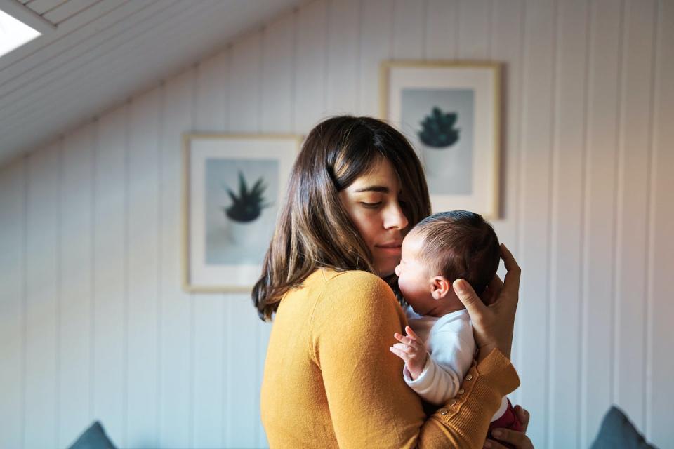 Negative health effects from cCMV may not show for a newborn until later. <a href="https://www.gettyimages.com/detail/photo/side-view-of-new-mother-comforting-her-newborn-royalty-free-image/1367022758" rel="nofollow noopener" target="_blank" data-ylk="slk:Juanma Hache/Moment via Getty Images;elm:context_link;itc:0;sec:content-canvas" class="link ">Juanma Hache/Moment via Getty Images</a>