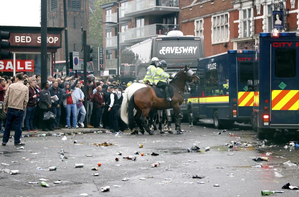 Britain Soccer Football - West Ham United v Manchester United - Barclays Premier League - Upton Park - 10/5/16 General view as bottles are thrown at the Manchester United team bus before the match Reuters / Eddie Keogh Livepic EDITORIAL USE ONLY. No use with unauthorized audio, video, data, fixture lists, club/league logos or "live" services. Online in-match use limited to 45 images, no video emulation. No use in betting, games or single club/league/player publications. Please contact your account representative for further details.