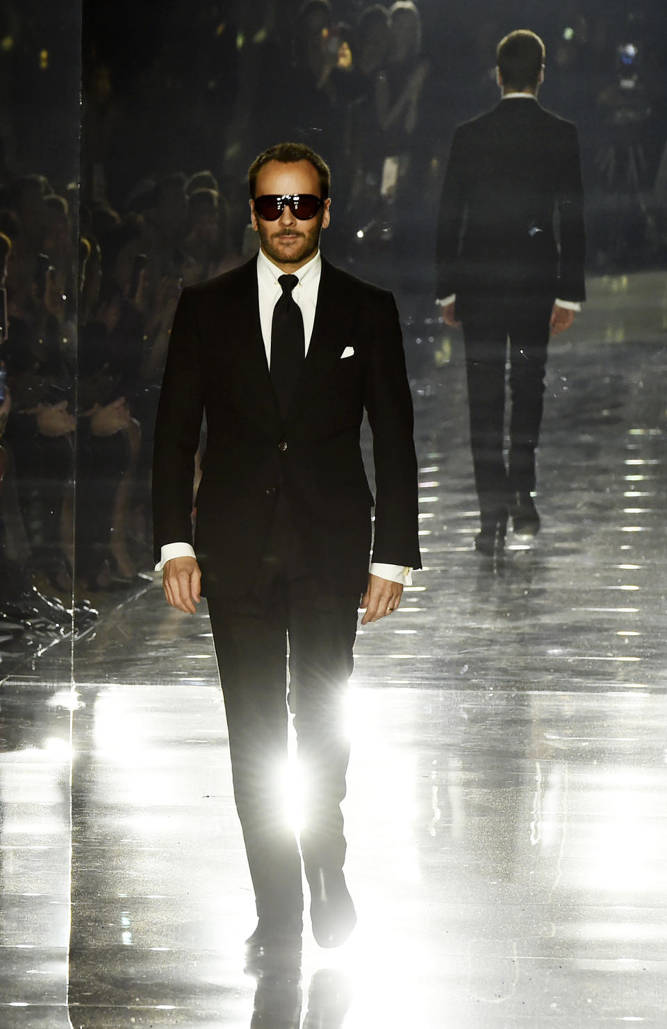 Designer Tom Ford walks the runway at the close of the NYFW Fall/Winter 2020 - Tom Ford fashion show at Milk Studios, Friday, Feb. 7, 2020, in Los Angeles. (AP Photo/Chris Pizzello)