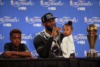 June 19, 2016; Oakland, CA, USA; Cleveland Cavaliers forward LeBron James (23) speaks to media with his children Lebron James Jr. and Zhuri James present following the 93-89 victory against the Golden State Warriors in game seven of the NBA Finals at Oracle Arena. Mandatory Credit: Kelley L Cox-USA TODAY Sports